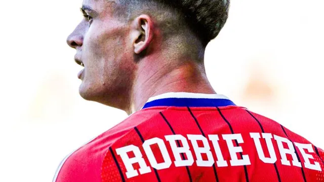 Why does Robbie Ure have first name on his Scotland shirt?